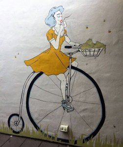 A mural on the wall at the Courtyard Coffee House in Tanunda - but what is in her basket?