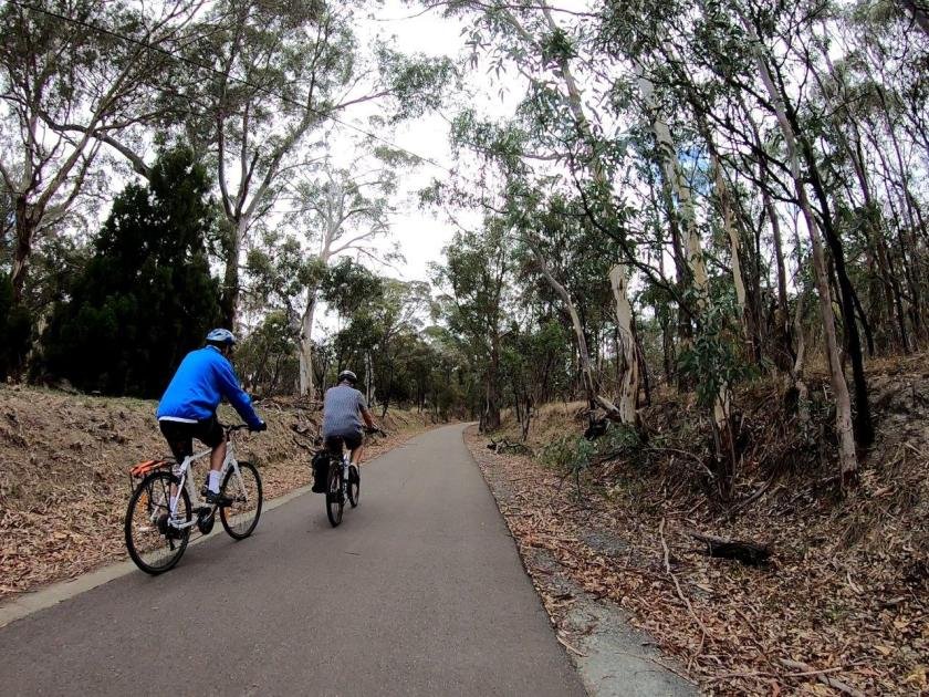 Amy Gillett Rail Trail between Mount Torrens and Charleston - two cyclists start the climb to Mount Torrens